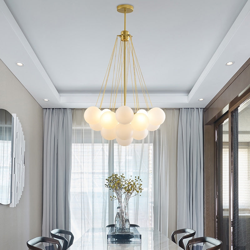 Opaque glass pendant with spherical distribution and metal parts