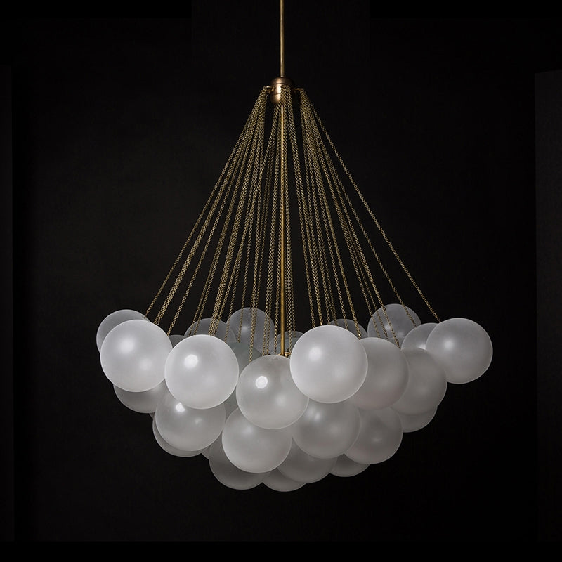 Opaque glass pendant with spherical distribution and metal parts