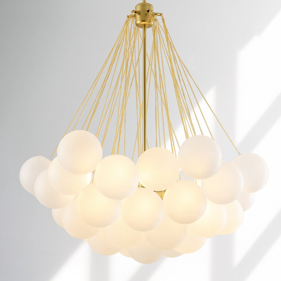 Opaque glass pendant with spherical distribution and metal parts