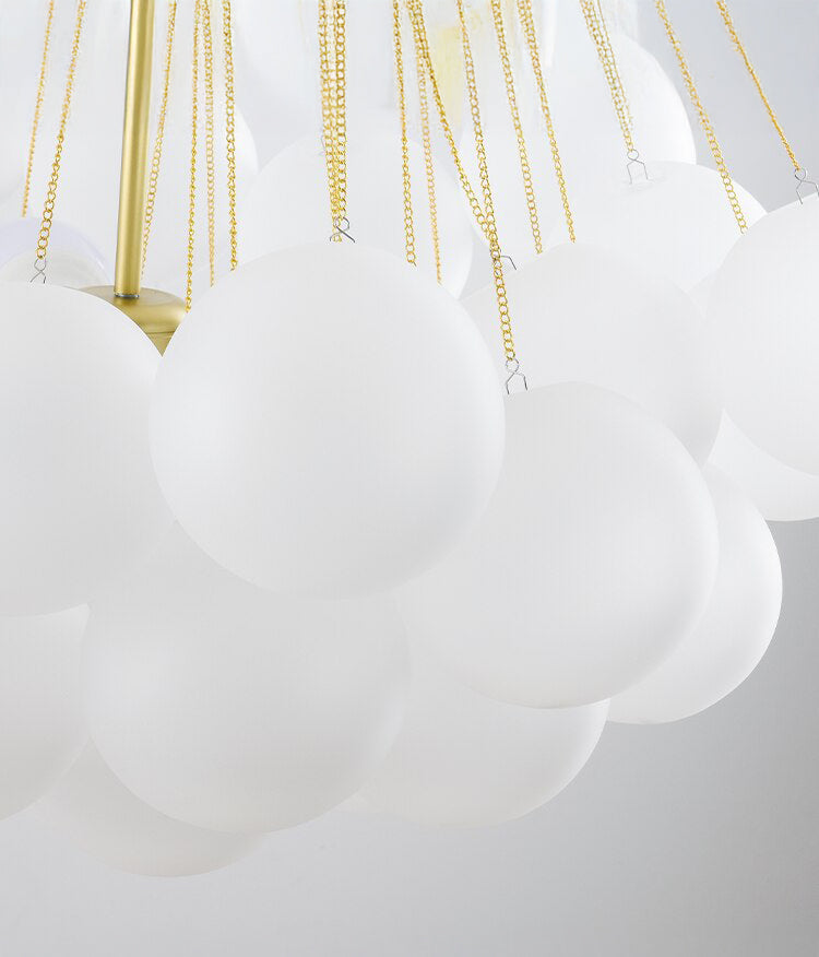 Opaque glass pendant with spherical distribution and metal parts