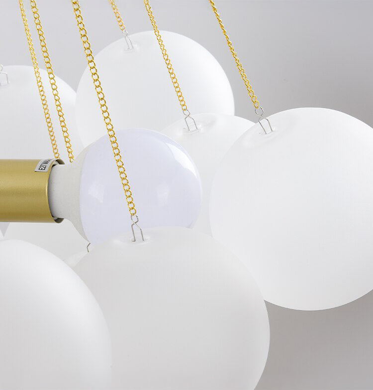 Opaque glass pendant with spherical distribution and metal parts